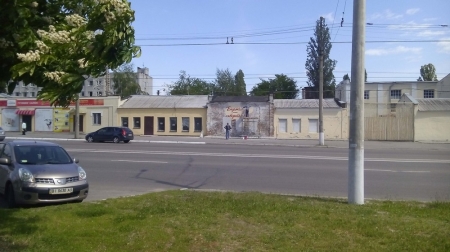 Фотофакт: в Кременчуге начали реставрировать граффити Кобзаря